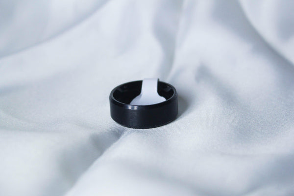 black ring , white background , front view